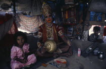 Man in his shanty house dressed up as the Hindu deity HanumanBavnagar Bhavnagar Mr Puna Trikham Asia Asian Bharat Inde Indian Intiya Religion Religion Religious Hinduism Hindus Bavnagar Bhavnagar...