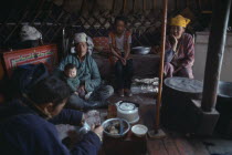 Mongolian family having meal inside a yurtAsia Asian Ger Kids Mongol Uls