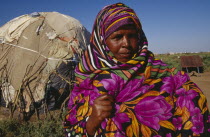 Somali woman refugee in a camp near the Somalia border.  Head and shoulders shot with shelter behind.African Eastern Africa Ethiopian Somalian Soomaliya  African Eastern Africa Ethiopian Somalian So...