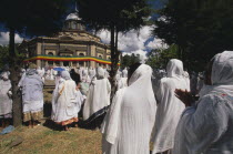 St George Church  Kidus Giorgis  the principle church in Addis Ababa draped in the colours of the national flag.  Large group of people gathered to attend ceremony.Orthodox African Eastern Africa Eth...