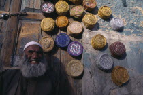 Vendor with display of muslim caps for sale.Asia Asian Islam Moslem Pakistani Islamic Religion Religious Muslims Islam Islamic Asia Asian Islam Moslem Pakistani Islamic Religion Religious Muslims Is...