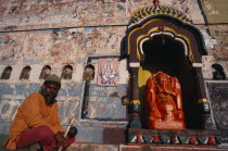 Sadhu at Ganesh shrine Asia Asian Bharat Inde Indian Intiya Religion Religious Asia Asian Bharat Inde Indian Intiya Religion Religious