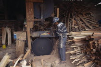Man working in saw mill.