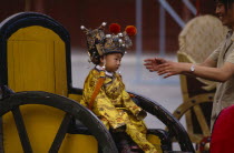 Little boy dressed as emperor for a photograph.single child Asia Asian Chinese Chungkuo Jhonggu Kids Peking Zhonggu Beijing single child Asia Asian Chinese Chungkuo Jhonggu Kids Peking Zhonggu B...