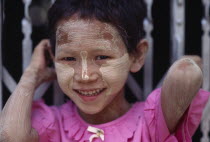 Portrait of young girl wearing skin protection made from tree bark.Asian Burma Burmese Kids Myanma Southeast Asia Myanmar Asian Burma Burmese Kids Myanma Southeast Asia Myanmar
