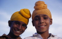Two Sikh boys.  Head and shoulders portrait  smiling.Asia Asian Bharat Happy Inde Indian Intiya Kids Religion Contented Religion Religious Sihism Sikhs Asia Asian Bharat Happy Inde Indian Intiya Kid...