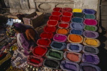 Rows of brightly coloured Thika paints for sale at the marketAsia Asian Colored Nepalese  Asia Asian Colored Nepalese