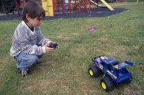 Boy with remote controlled truck.