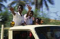 Children waving from the back of a truck driven by man.Asia Asian Kids Llankai Lorry Sri Lankan Van  Asia Asian Kids Llankai Lorry Sri Lankan Van