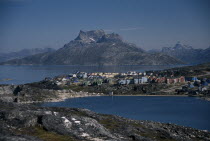 Town houses in rocky landscape looking north across Lake Vandso. Greenland Denmark Danish Danmark Kalaallit Nunaat Nordic Northern Europe Scandinavia Scenic European
