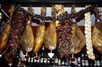 Dried cured hams in a typical bar and restaurant.TravelTourismHolidayVacationExploreRecreationLeisureSightseeingTouristAttractionTourDestinationTripJourneySevilleSevillaAndaluciaAnda...