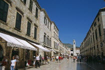 Looking along Stradun to Bell tower  Gradski Zvonik . Former YugoslaviaTravelTourismHolidayVacationAdventureExploreRecreationLeisureSightseeingTouristAttractionTourDubrovnikDalmatiaDalm...