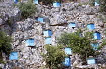 Blue beehives on side of cliff.TravelTourismHolidayVacationExploreRecreationLeisureSightseeingTouristAttractionTourDestinationKefaloniaKefalonianKephaloniaKephalonianKefalloniaKefall...