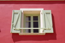 Lixouri  Stil Tipaldou  Green and cream window and pink wall of house.TravelTourismHolidayVacationExploreRecreationLeisureSightseeingTouristAttractionTourDestinationLixouriKefaloniaKefa...