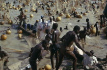 Fishing Festival  mass of men and nets along stretch of river.African Nigerian Western Africa Male Man Guy Male Men Guy