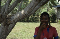 Portrait of Yoruba girl eating groundnuts.African Nigerian Western Africa One individual Solo Lone Solitary