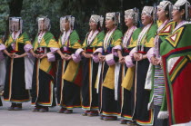 Tibetans wearing traditional costume to celebrate the birthday of the Dalai LamaDharmsala Asia Asian Bharat Inde Indian Intiya Religion Religious Classic Classical Historical Older History