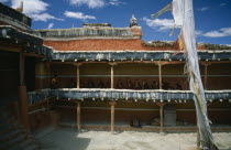 Tibetan Buddhist monks awaiting the arrival of the King from upper balcony of temple courtyard.Asia Asian Nepalese Religion Religion Religious Buddhism Buddhists