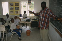Teacher and pupils in classroom of private school.African Kids Learning Lessons Nigerian Teaching Western Africa