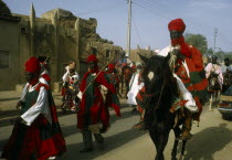 Nigeria, Kano. Emir on horseback with his entourage during Salah Day celebrations marking the end of Ramadan.
