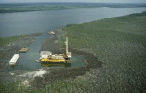 Aerial view over oil rig in swamp near Bonny.African Nigerian Western Africa