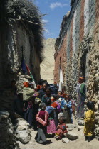 People carry sacred texts through narrow street for the Lok Khor festival when prayers and offerings are made to ensure good harvests and protection for the home. Asia Asian Kids Nepalese Religion Re...