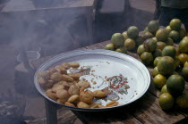 Deep fried pea cakes and green oranges.African Nigerian Western Africa