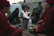 High ranking Lama performing hair cutting ceremony.Asia Asian Kids Nepalese Performance Religion Religious