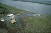 Oil rig in the swamp beside a riverAfrican Nigerian Western Africa