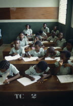 Children at desks in a classroomAfrican Kids Learning Lessons Nigerian Teaching Western Africa