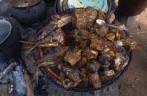 Fish being grilled in the marketAfrican Nigerian Western Africa