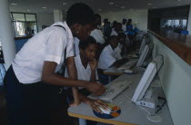 Men and women working at British Council computersAfrican Female Woman Girl Lady Learning Lessons Male Man Guy Nigerian Teaching Western Africa Female Women Girl Lady Male Men Guy