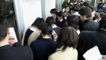 Chiba  Sosa - Yokaichiba Kei Ai High School  14 and 15 year old third year junior high school students crowd to see if their number is posted meaning they passed the high school entrance examAsia Asi...