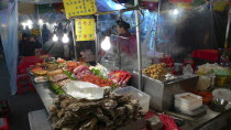 Namdaemun market  street restaurant  stacks of meat and fish waiting to be dooked  oysters in foregroundAsia Asian Classic Classical Daehanminguk Hanguk Historical Korean Older Tradition History