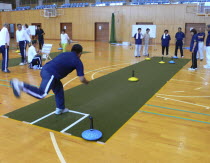 Chiba  Nosaka -at town gym  adults  all over fifty years old  playing unicurl  indoor version of curling  recreationAsia Asian Japanese Nihon Nippon