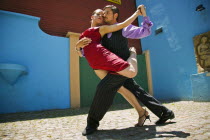 Tango dancers in La Boca.RedColourLa BocaHolidaysTourismTravelBuenos AiresSouth AmericaArchitectureTangoIconPoseDanceTwoAmerican Argentinian Color Hispanic Latin America Latino Performa...