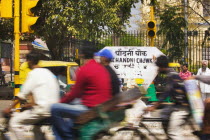 Street sign on bustling Chandni Chowk.DestinationDelhiTourismTravelHolidaysAsiaSub-ContinentBlurBusyChandni ChowkOld DelhiTrafficRickshawAsian Bharat Inde Indian Intiya