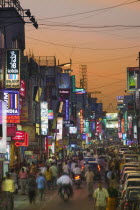 Commercial Street at dusk.StreetCrowdedSub-ContinentAsiaTravelCommerceTradeNightNeonBusyIndiaAsiaCrowdsChaosBangaloreKarnatakaCommercialBusinessAsian Bharat Inde Indian Intiya Nite