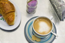 Coffee and croissant in one of the numerous cafes in the city centre.CoffeeCroissantCafeFoodContinental BreakfastTreatDiningTastySnackBar Bistro Center Chilean Hispanic Latin America Latino...