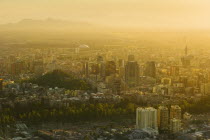 City view at sunset from Cerro San Cristobal.Jon Hicks.TravelHolidaysTourismLatin AmericaSantiagoChileSouth AmericaUrbanSkylineViewpointCerro San CristobalPollutionSmogHazeCapitalCity...