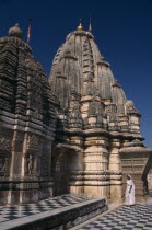 Sachiya Mata Temple with a woman dressed in white standing at the baseAsia Asian Nepalese Bharat Inde Indian Intiya Male Men Guy Male Man Guy Religion Religious Kids Learning Lessons Teaching History...
