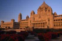Umaid Bhawan Palace exterior seen at sunset from gardensAsia Asian Nepalese Bharat Inde Indian Intiya Male Men Guy Male Man Guy Religion Religious Kids Learning Lessons Teaching History Performance C...