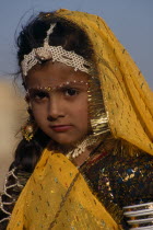 Portrait of a young girl wearing yellow with make up and jewellery an entrant in the Miss Desert Competition at the Mini Maru Mela Festival.Asia Asian Nepalese Bharat Inde Indian Intiya Male Men Guy...
