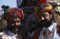 Two Rajput men with beards wearing ceremonial dress and turbans at the start of the Camel FestivalAsia Asian Nepalese Bharat Inde Indian Intiya Male Men Guy Male Man Guy Religion Religious 2