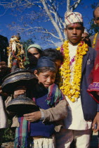 The groom in a wedding procession wearing a marigold garland in the valley of Sangawa KholaAsia Asian Nepalese Kids Marriage Religion Religious