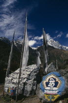 Mani Stones and Prayer Flags in Ghat Village.Asia Asian Nepalese Religious Scenic Religion