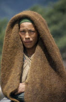 Portrait of Herdswoman wearing a yak wool blanket over her headAsia Asian Nepalese One individual Solo Lone Solitary