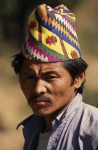 Head and shoulders portrait of a man wearing a Topi  traditional hat near Chainpur VillageAsia Asian Nepalese Classic Classical Historical Male Men Guy Older History Male Man Guy One individual Solo...