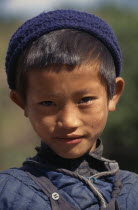 Head and shoulders portrait of young Gurung boy in Bhadauri villageAsia Asian Nepalese Kids Immature One individual Solo Lone Solitary