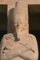 Deir-el-Bari. Hepshepsut Mortuary Temple. Hepshepsut statue reprenseted as a male with a beard and crossed arms bearing the crook and flailAfrican Middle East North Africa History Religion Religious